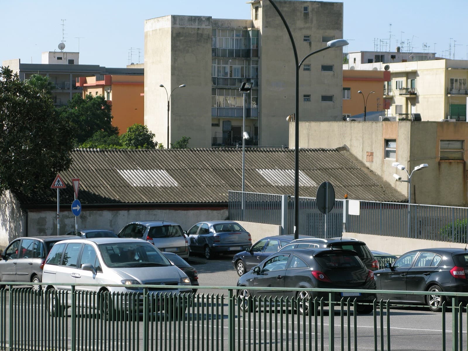Building with a fibre-cement roof among city blocks